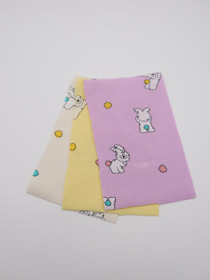 カラフルしっぽウサちゃんプリント・綿ベア天竺｜152cm超広幅・PU5%混・ストレッチ・薄手・高意匠・低刺激｜ドッグウェア・子供服・ロンパース向き｜26SS-081【生地仕入れ代行卸】