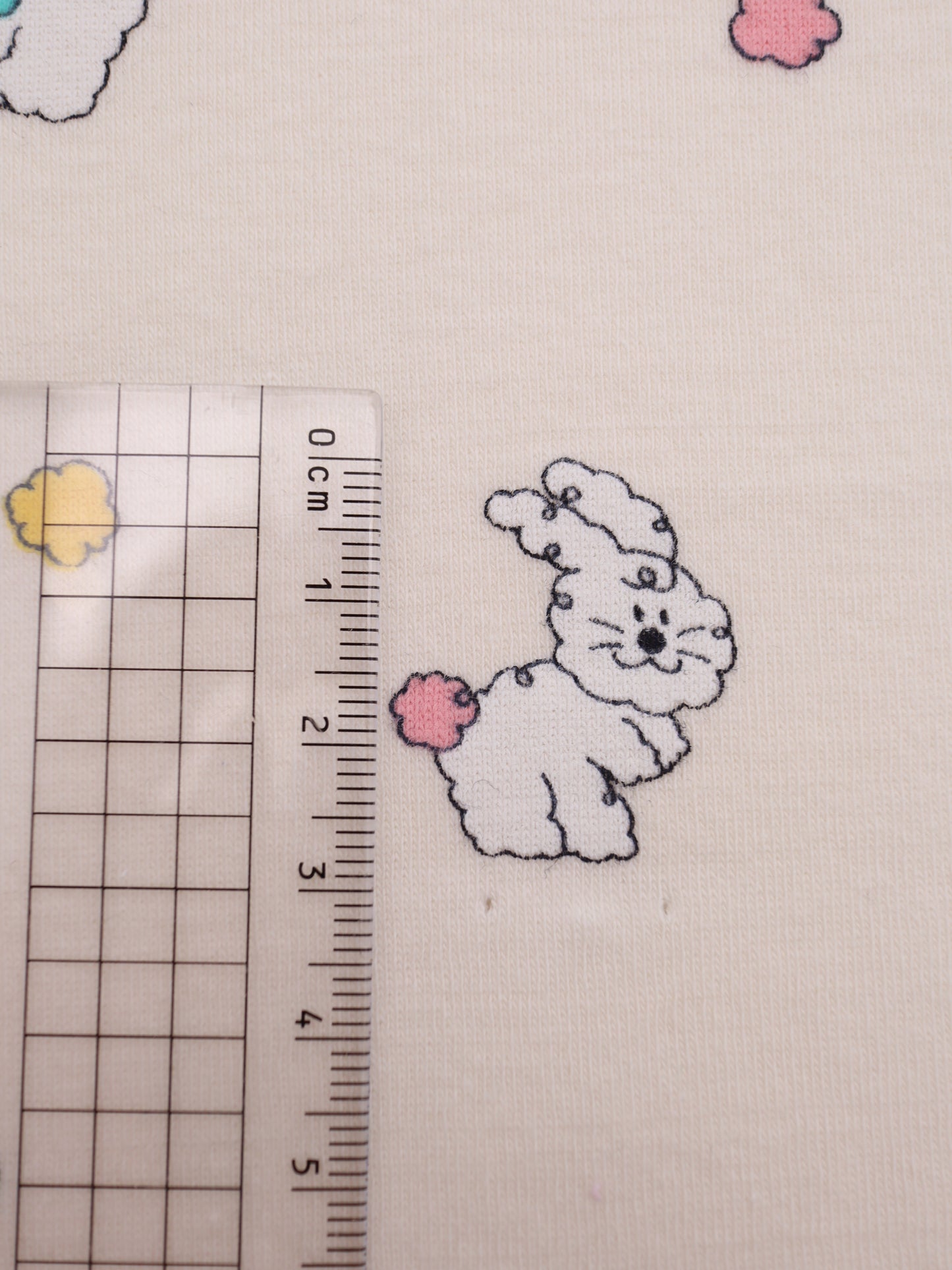 カラフルしっぽウサちゃんプリント・綿ベア天竺｜152cm超広幅・PU5%混・ストレッチ・薄手・高意匠・低刺激｜ドッグウェア・子供服・ロンパース向き｜26SS-081【生地仕入れ代行卸】