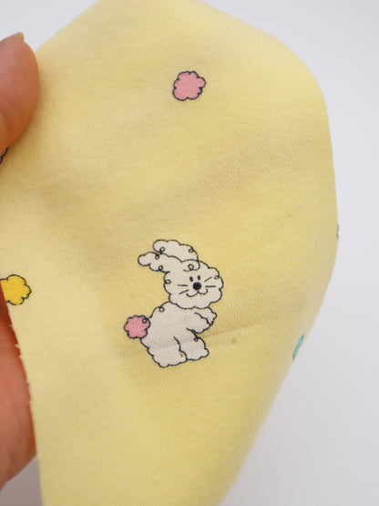 カラフルしっぽウサちゃんプリント・綿ベア天竺｜152cm超広幅・PU5%混・ストレッチ・薄手・高意匠・低刺激｜ドッグウェア・子供服・ロンパース向き｜26SS-081【生地仕入れ代行卸】