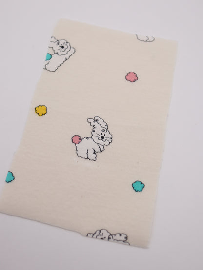 カラフルしっぽウサちゃんプリント・綿ベア天竺｜152cm超広幅・PU5%混・ストレッチ・薄手・高意匠・低刺激｜ドッグウェア・子供服・ロンパース向き｜26SS-081【生地仕入れ代行卸】