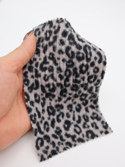 【25AW-167】プチヒョウ柄プリントランダムプリーツ加工起毛天竺ニット　/0.5ｙあたり=～1125円