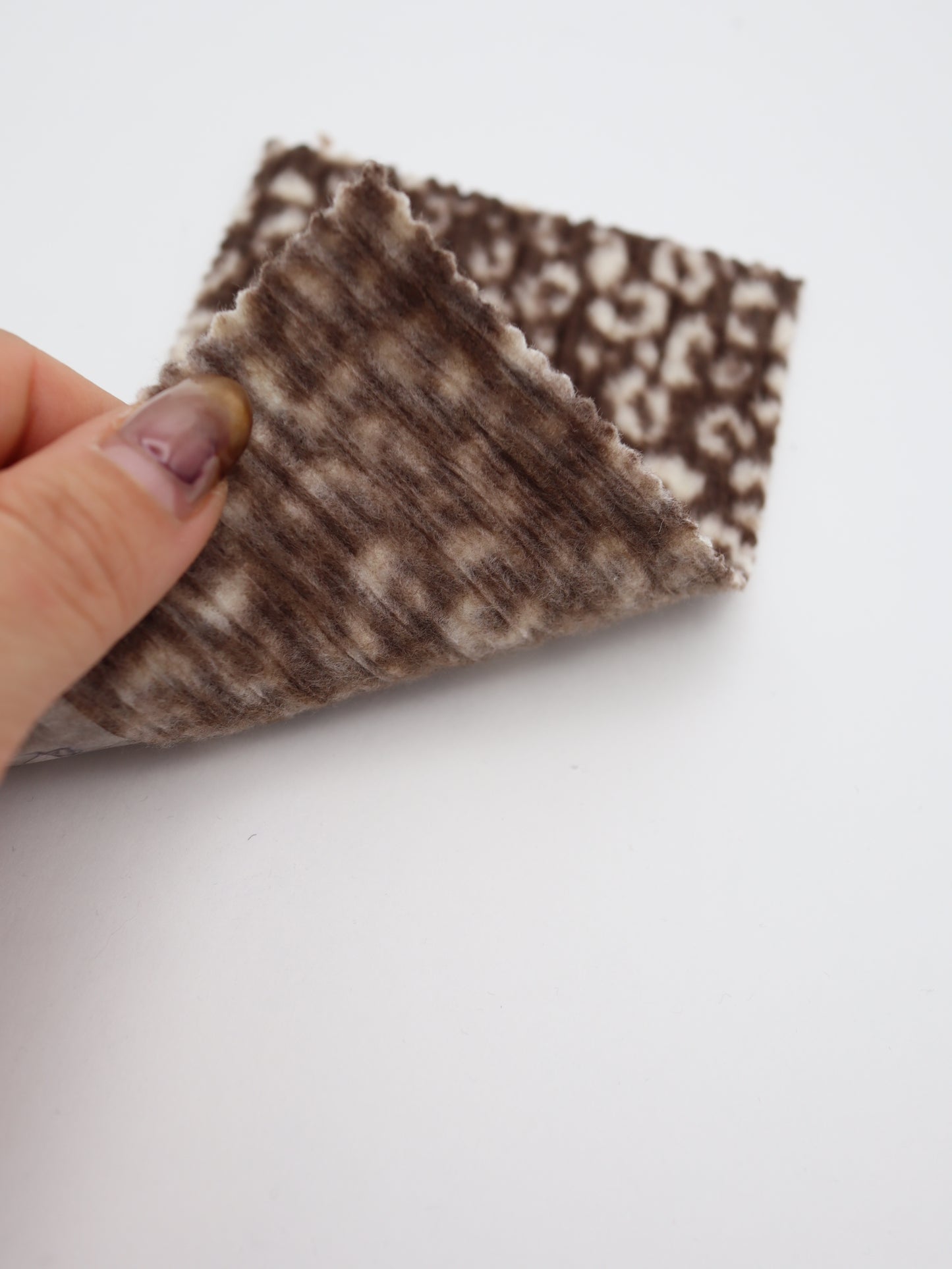 【25AW-167】プチヒョウ柄プリントランダムプリーツ加工起毛天竺ニット　/0.5ｙあたり=～1125円